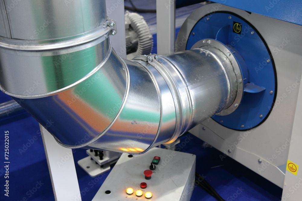 Big metal pipe of ventilation system of the woodworking machine