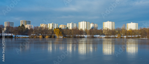 Winter panorama of cityscape by frozen lake © Gabdulvachit