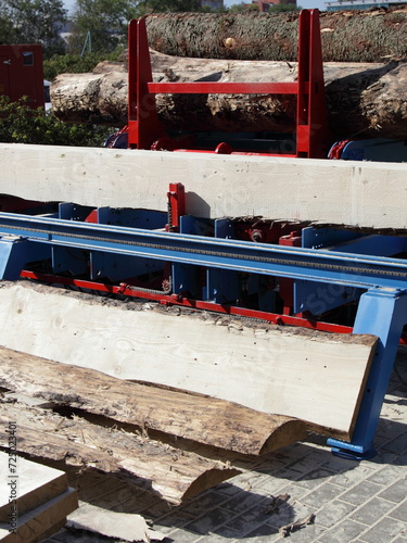 Wood boards and Big logs on woodworking machine