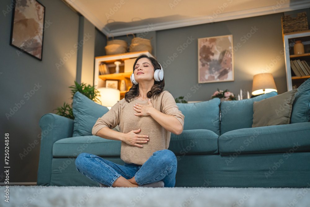 Obraz premium adult woman practice guided yoga meditation at home