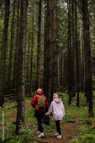 Couple walking in mountain forest