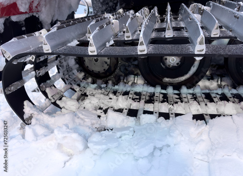 Snowcat machine for snow removal. Preparation ski trails. Snow groomer. Snowy tracks of snowcat in the mountains. Ratrac snowcat. Snow tucker photo