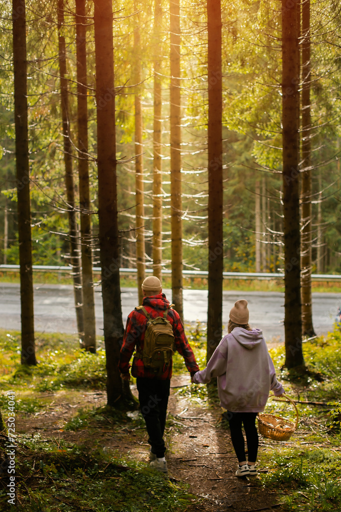 Fototapeta premium Couple walking in mountain forest