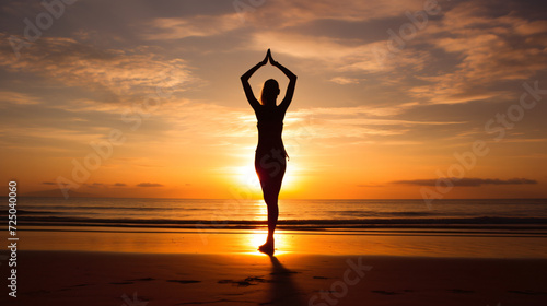 A woman doing yoga on the beach