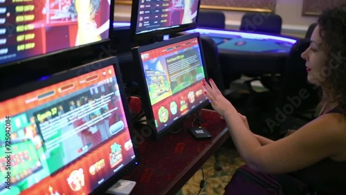 Woman playing on computer in Bingo Boom bookmaker club photo