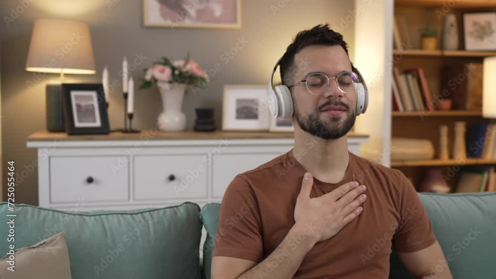 man with headphones practice guided meditation yoga self care at home man with headphones practice guided meditation yoga self care at home