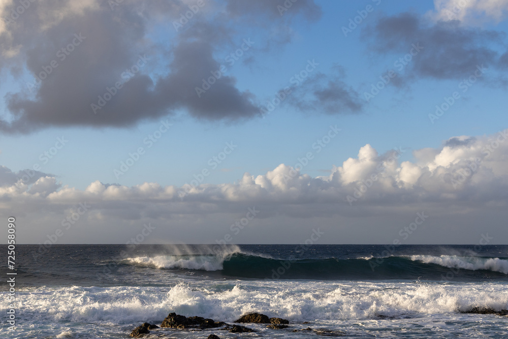 Waves rolling in over volcanic rock in Puert de las Nieves, Gran Canaria, Spain