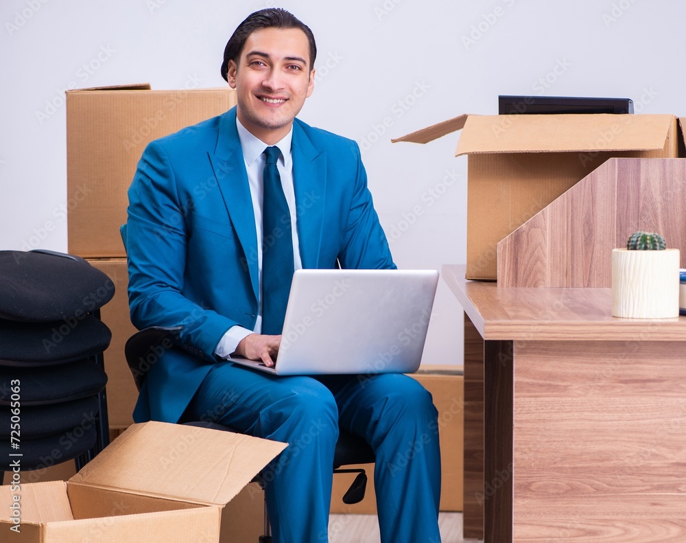 Young handsome businessman being fired from his work Young handsome businessman being fired from his work