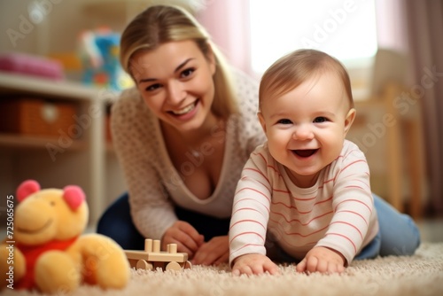 Mother and baby playing happily on the floor