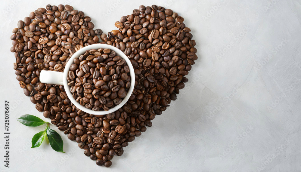 Top view of arabica beans arranged in a beautiful heart shape on white background. Coffee beans Top view of arabica beans arranged in a beautiful heart shape on white background. Coffee beans