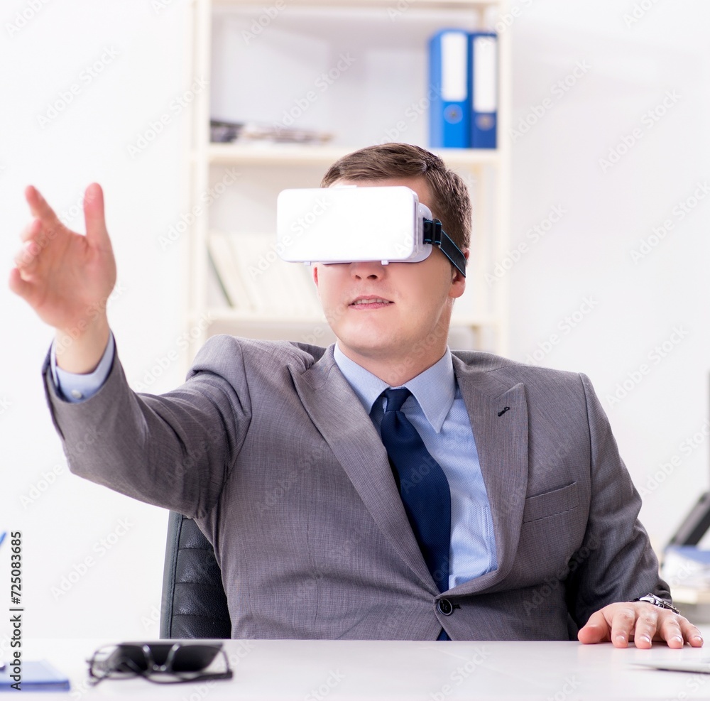 Businessman with virtual reality glasses in office Businessman with virtual reality glasses in office