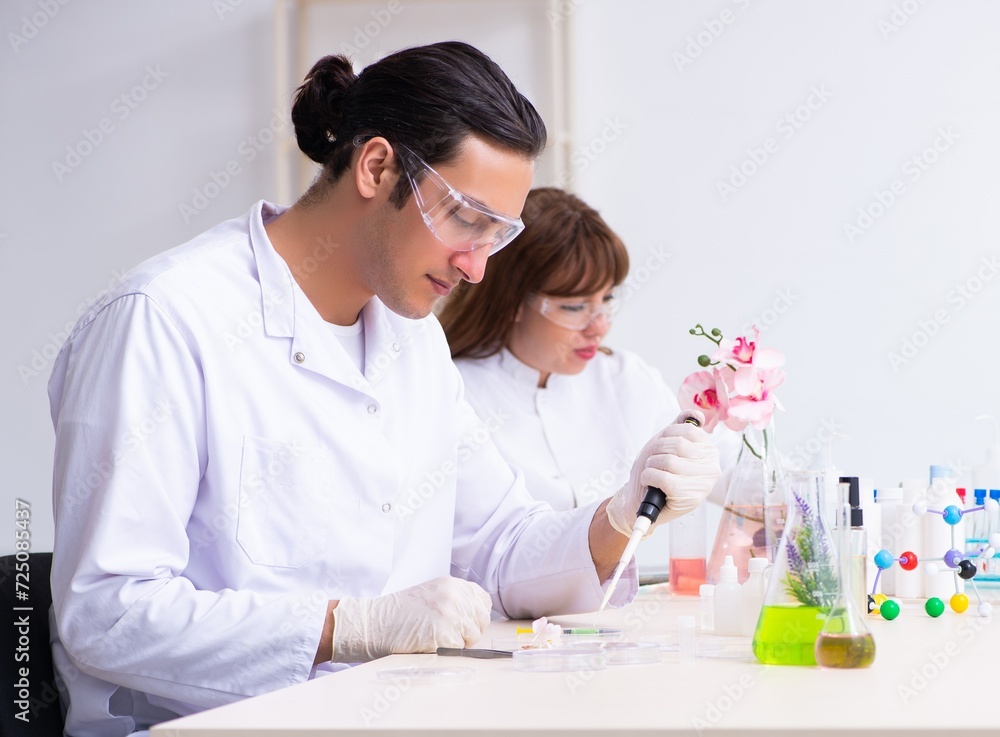 Two chemists working in the lab Two chemists working in the lab