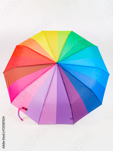 Multicolored umbrella on a white background. The colors of the LGBT community.