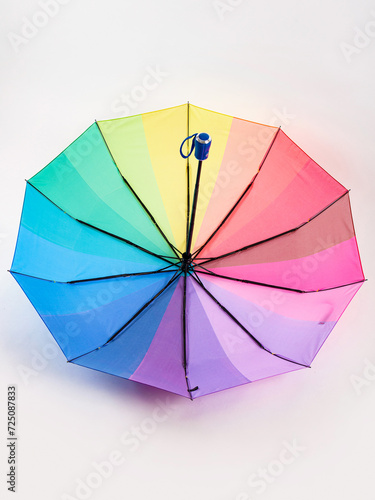 Multicolored umbrella on a white background. The colors of the LGBT community.