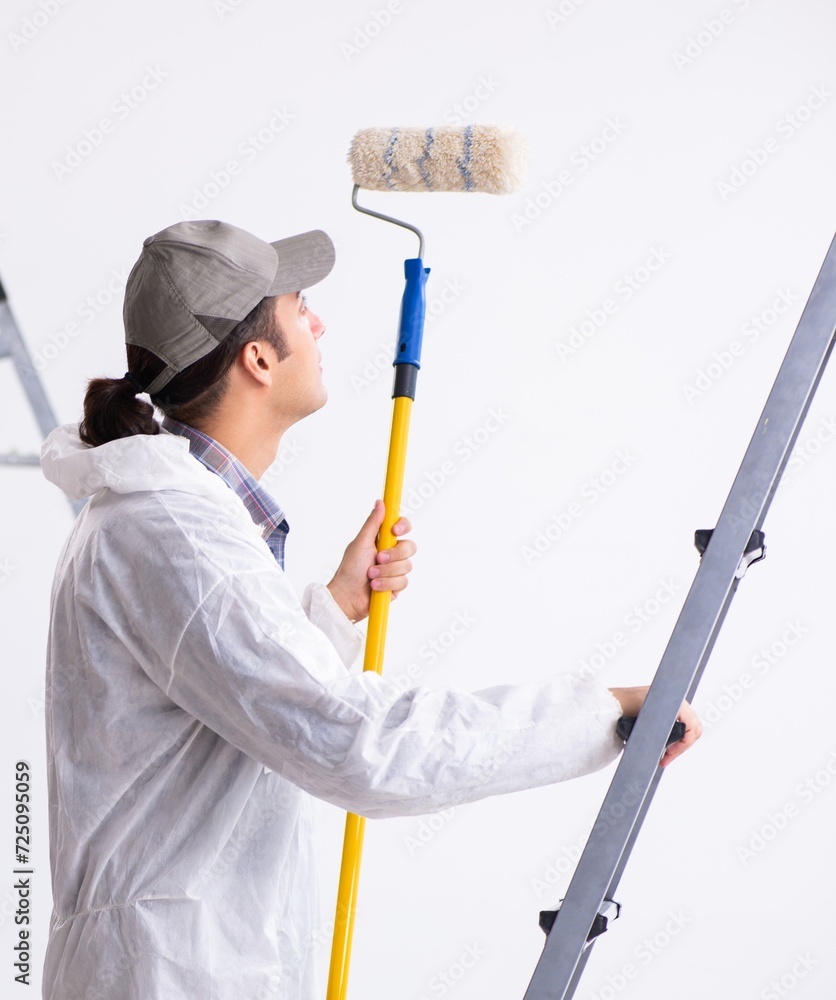 Painter working at construction site Painter working at construction site