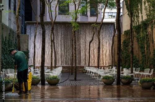 man cleaning a plaza
