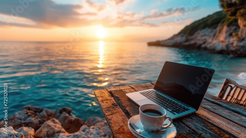 Fototapeta Naklejka Na Ścianę i Meble -  outdoor office or workspace with laptop and coffee cup at sea beach on summer holiday.