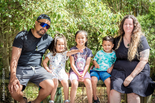 A close up portrait of young multiracial New Zealand family.