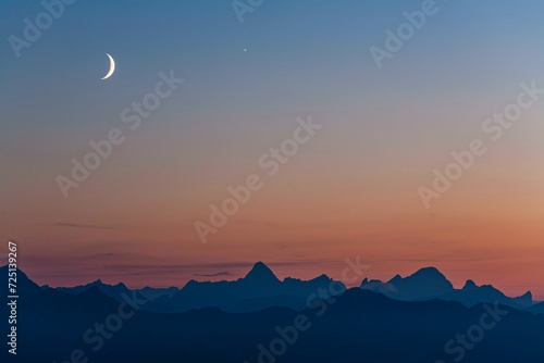 Mountain range at dusk with crescent moon, summer, Allgaeu Alps, Allgaeu, Germany, Europe photo