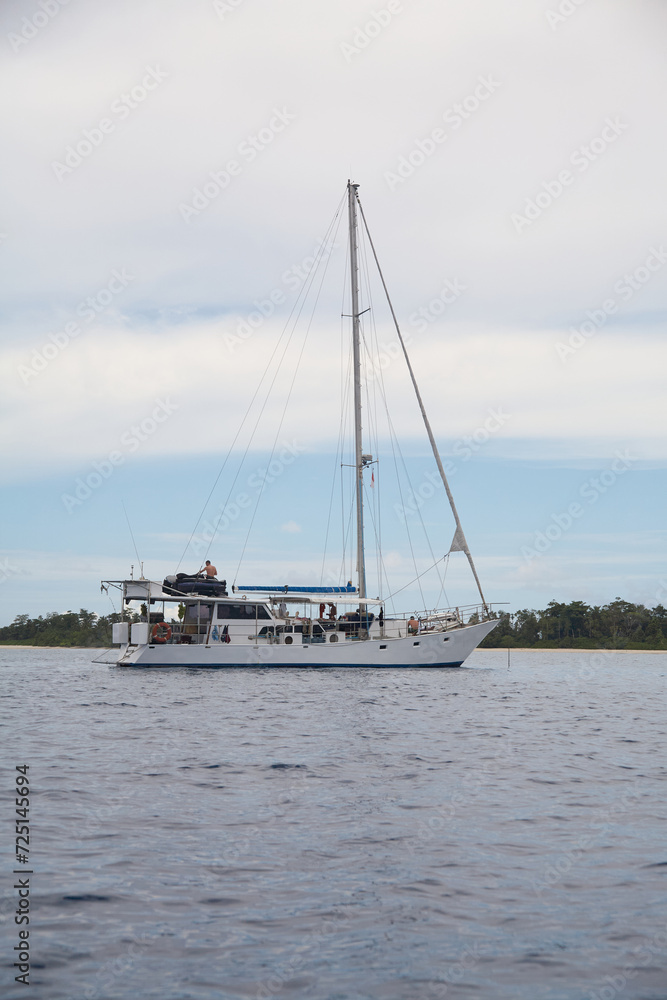 Large sail boat near the Mentawai Islands with surfers Large sail boat near the Mentawai Islands with surfers