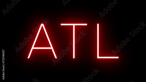 Glowing and blinking red retro neon sign with the three-letter identifier for Atlanta International Airport photo