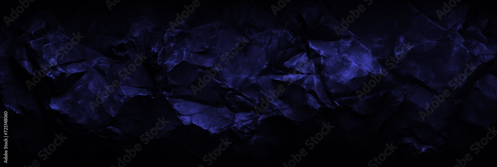 Panoramic navy stone background for banner design. Blue rock grunge texture. Mountain surface close-up cracked empty copy space