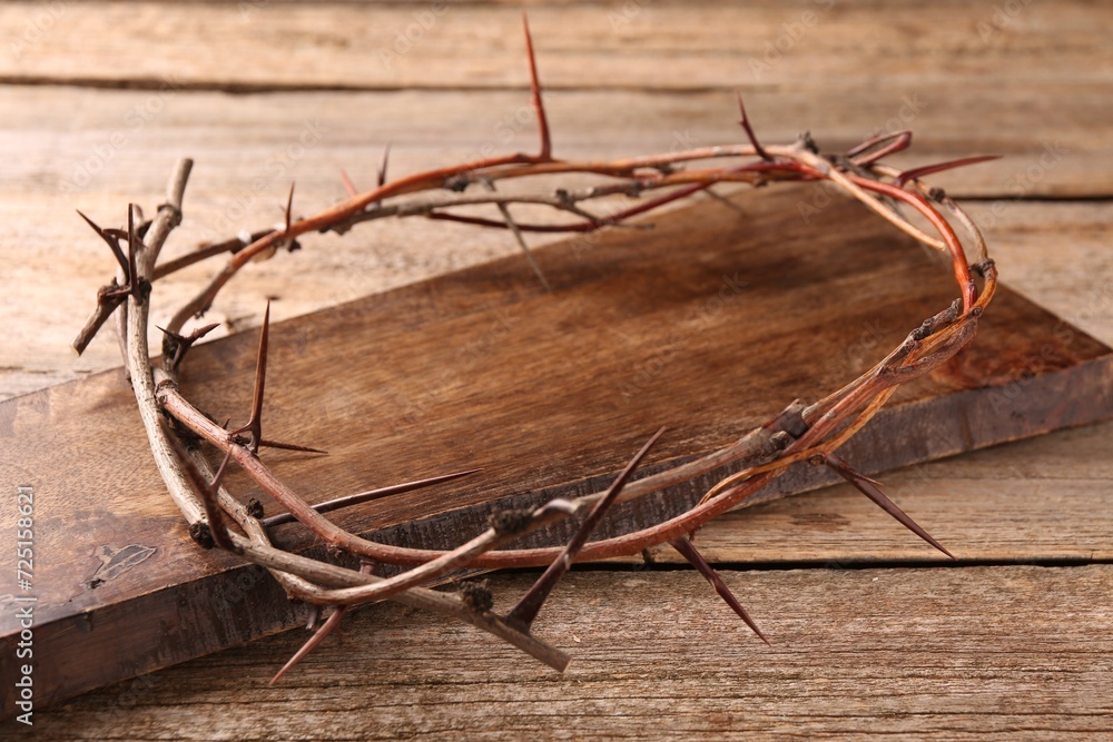 Crown of thorns on wooden table, closeup Crown of thorns on wooden table, closeup
