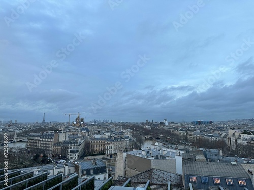 Beautiful buildings in Paris on cloudy day, view from hotel window