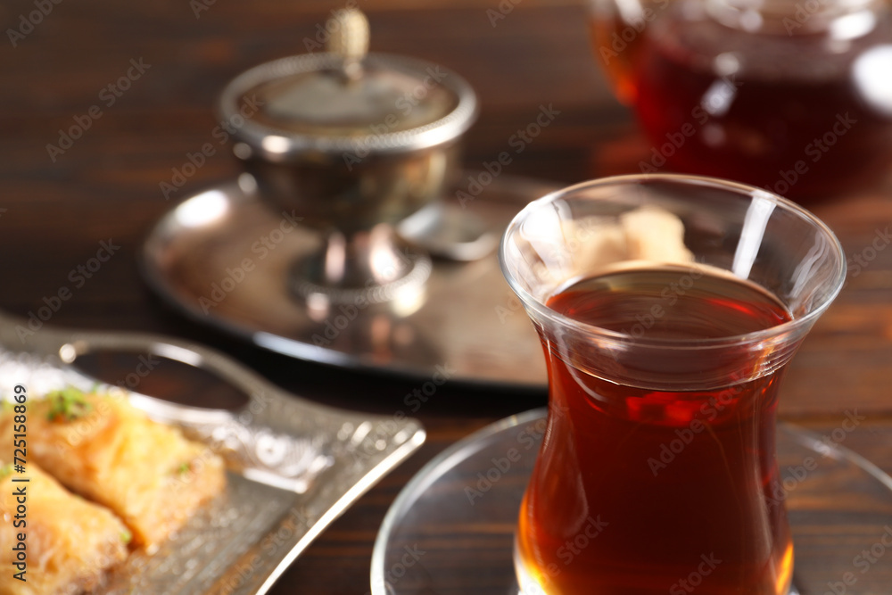 Traditional Turkish tea in glass on table, closeup. Space for text Traditional Turkish tea in glass on table, closeup. Space for text