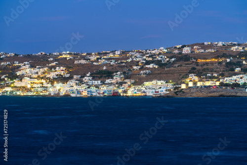 Mykonos village illuminated at dusk on Mykonos island. Greece