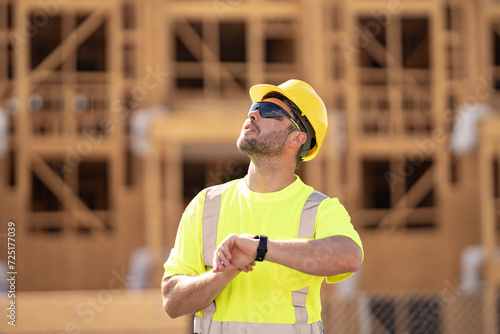 Photography Worker in building uniform on buildings construction background