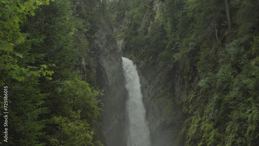 Experience the serene beauty of an Austrian forest waterfall surrounded by trees. Nature's tranquil masterpiece awaits. Experience the serene beauty of an Austrian forest waterfall surrounded by trees. Nature's tranquil masterpiece awaits.