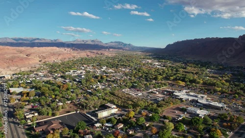 High elevation drone shot of moab, utah on a sunny day in the fall photo