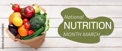 Banner for National Nutrition Month with fresh vegetables and fruits in shopping bag photo