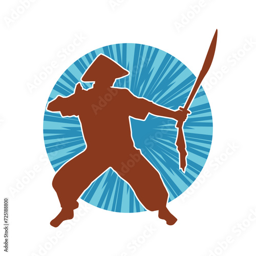 Silhouette of a kungfu or wushu martial art athlete in action pose. Silhouette of a male martial art person in pose with swords weapon.