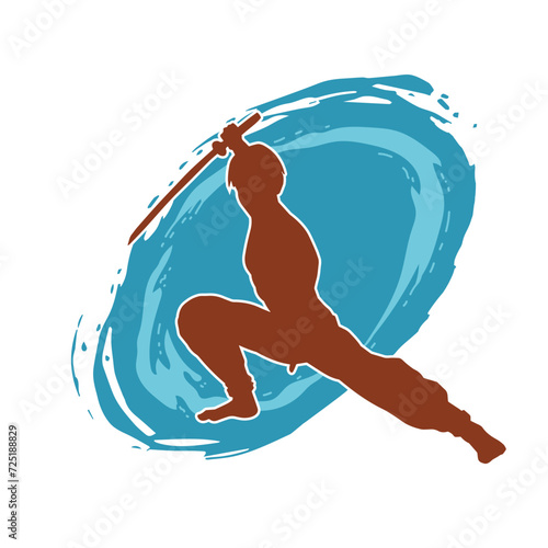 Silhouette of a male warrior in action pose with sword weapon. Silhouette of a man fighter carrying sword weapon.