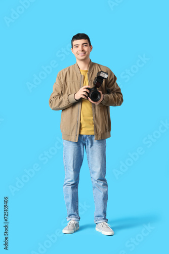 Young male photographer wit...