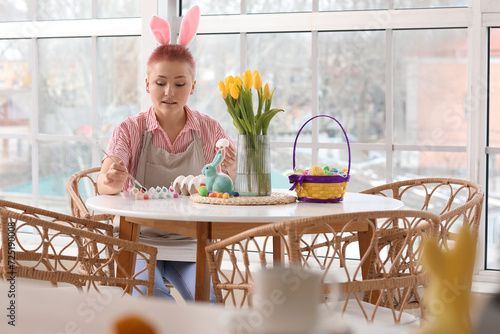 Young woman with pink bunny...