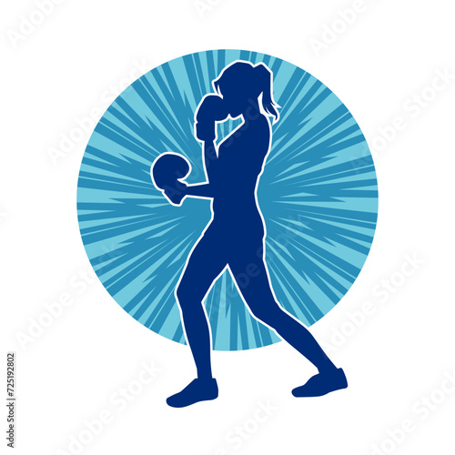 Silhouette of woman boxing athlete in action pose. Silhouette of a female wearing boxing gloves for boxing sport.