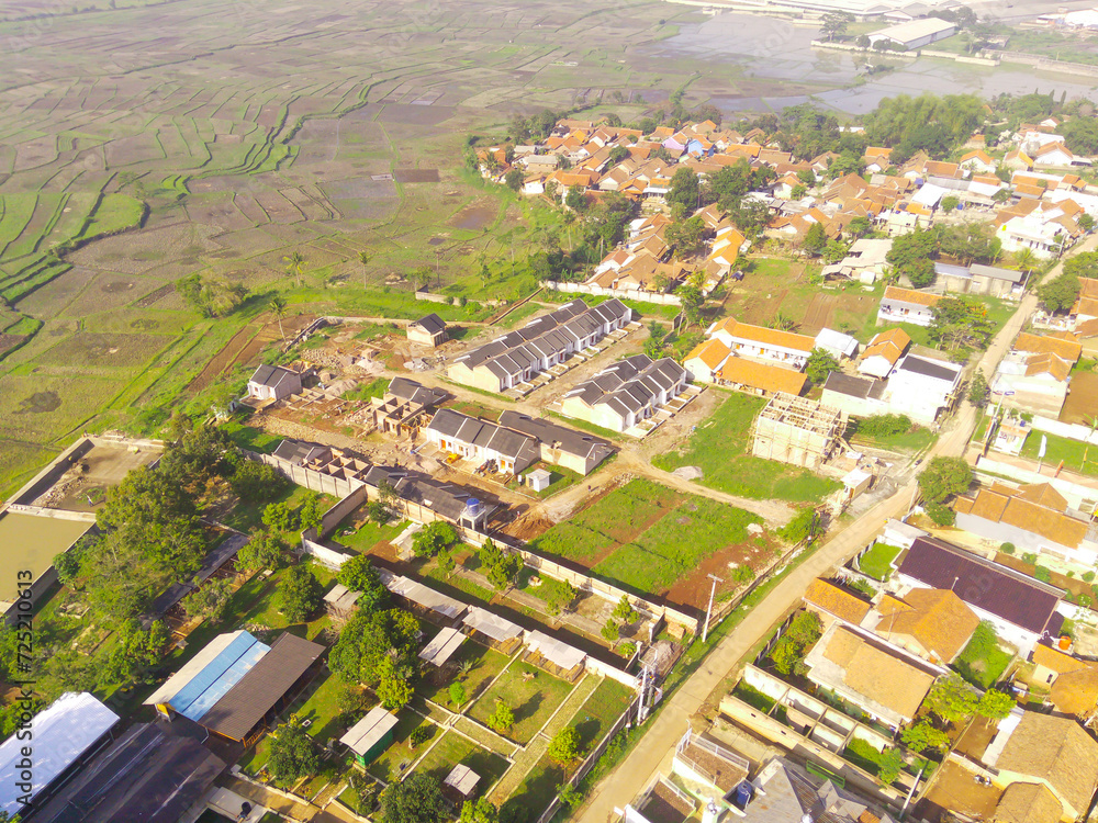 Top view Small Housing. Aerial Photography. Aerial panorama over small isolated housing complex. Shot from a drone flying 200 meters high. Cikancung, Indonesia