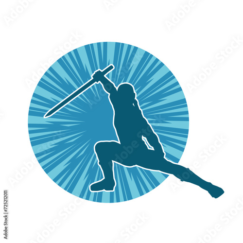 Silhouette of a male warrior in action pose with sword weapon. Silhouette of a man fighter carrying sword weapon.