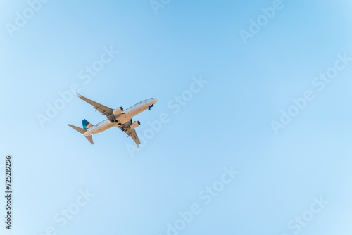 Airplane before landing in blue sky, Boeing 737-800