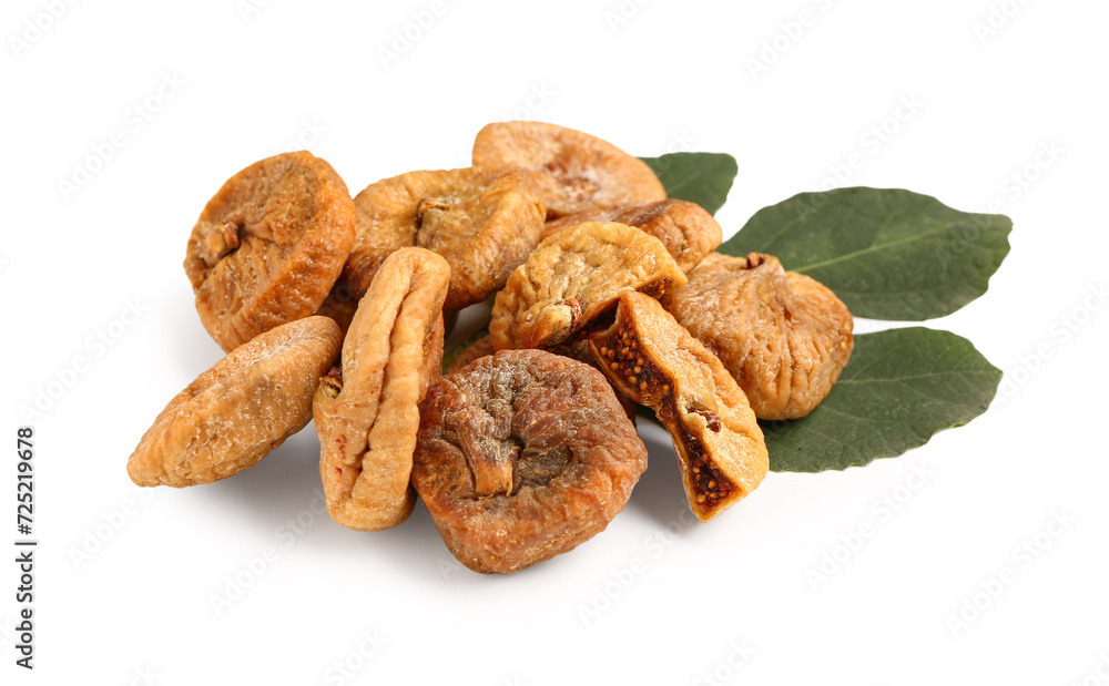 Sweet dried figs and leaf on white background