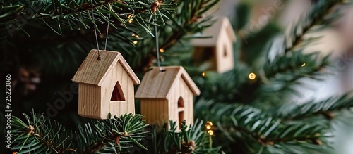 wooden house on the branches of a Christmas tree. concept of decoration at Christmas celebrations.