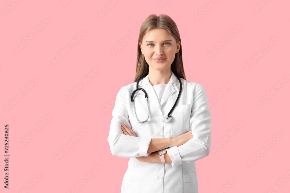 Beautiful young doctor on pink background Beautiful young doctor on pink background
