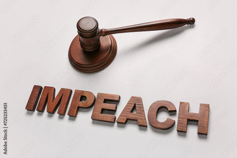 Judge gavel and word IMPEACH on white background Judge gavel and word IMPEACH on white background