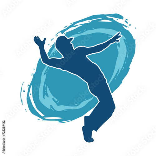 Silhouette of a man in dancing pose. Silhouette of a male dancer in performing pose.