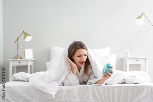 Angry young woman with alar...