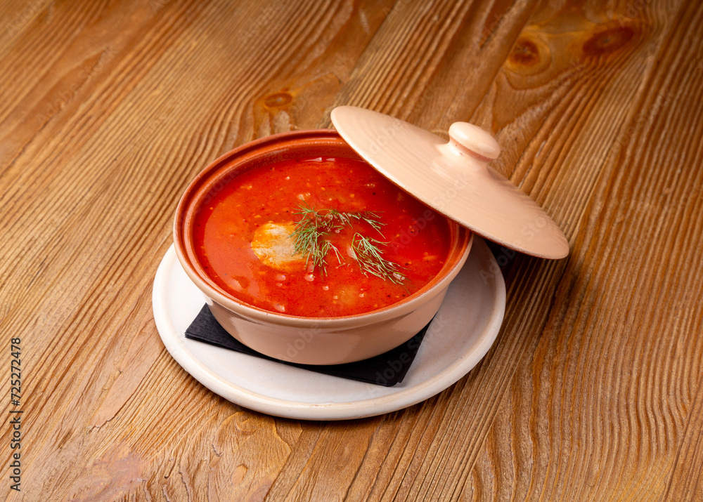 Kharcho soup on wooden background Kharcho soup on wooden background