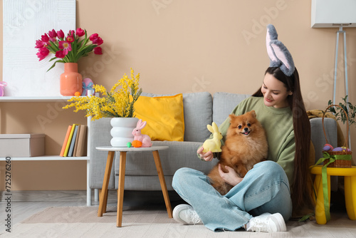 Young woman with cute Pomer...